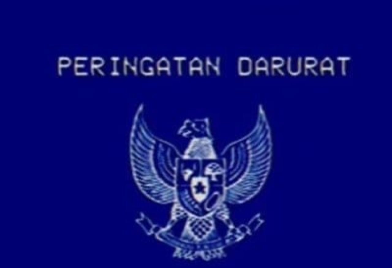 Gambar lambang burung garuda bertuliskan "Peringatan Darurat".